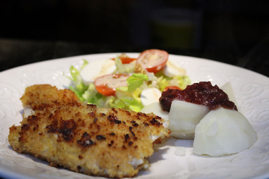 Mustard battered fish with potatoes and salad