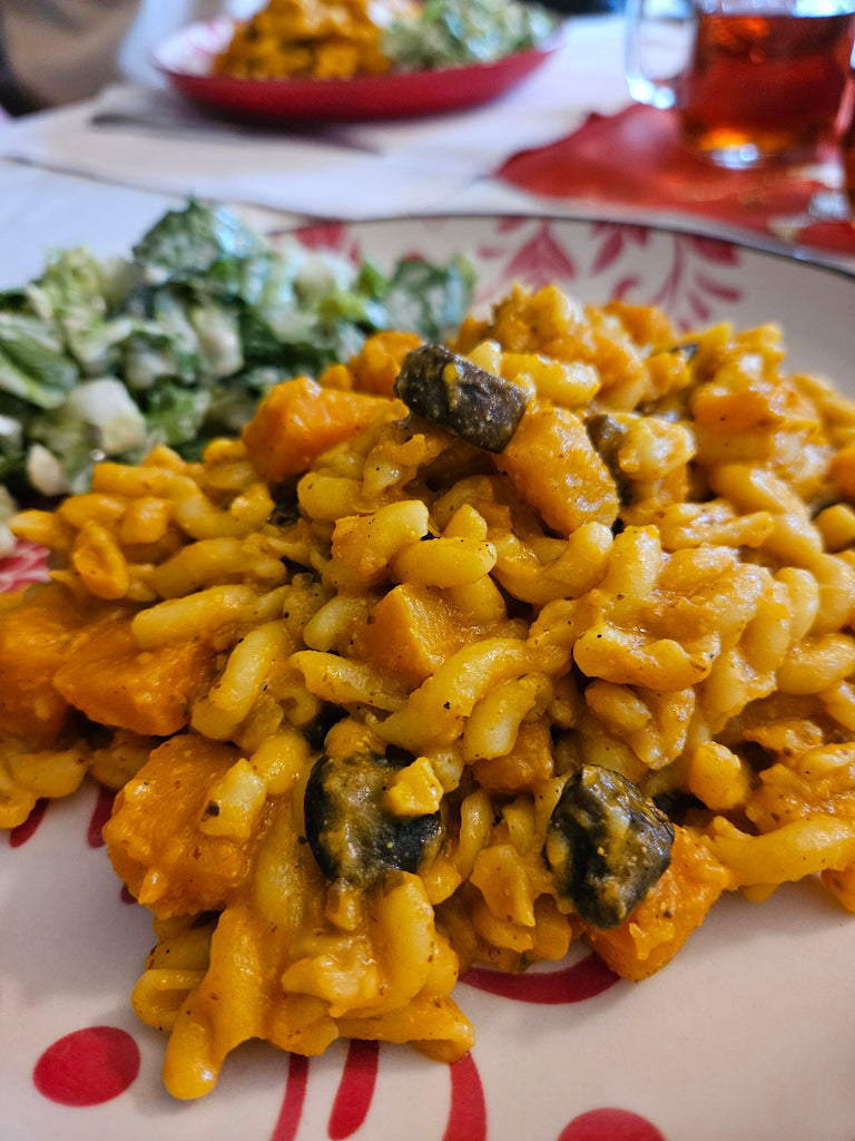 Pasta bowl with pumpkin and champignons
