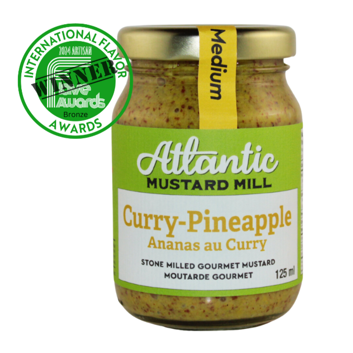 A jar of Curry Pineapple mustard with the badge of the bronze winner from the Flavor Awards