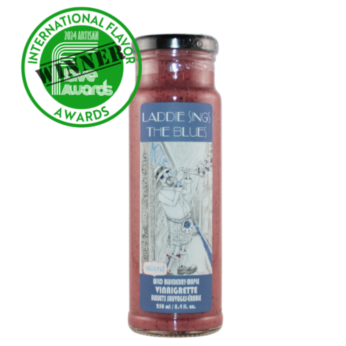 A bottle of Vinaigrette with Blueberries and a badge of the Winner for the International Flavor awards