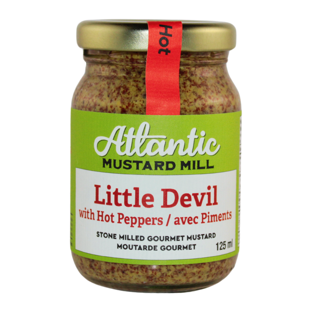 A jar of mustard with hot peppers called little devil