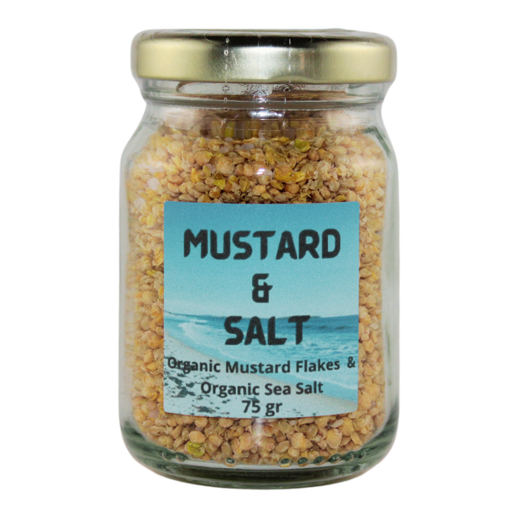 A jar with mustard and salt flakes