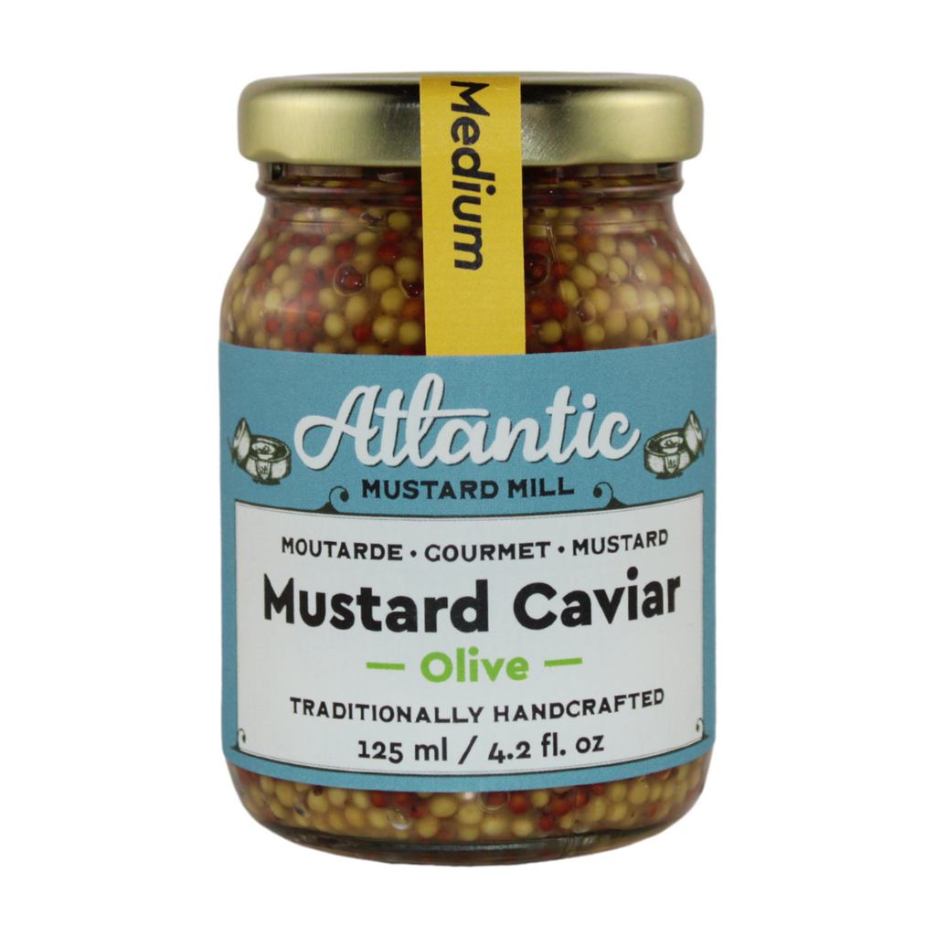 A jar of mustard caviar with crushed olives