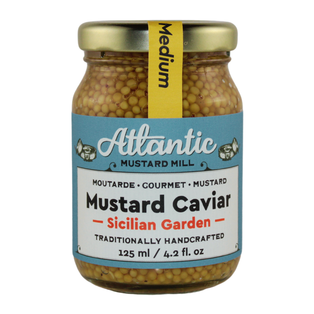 A jar of mustard caviar with orange and lemon juice